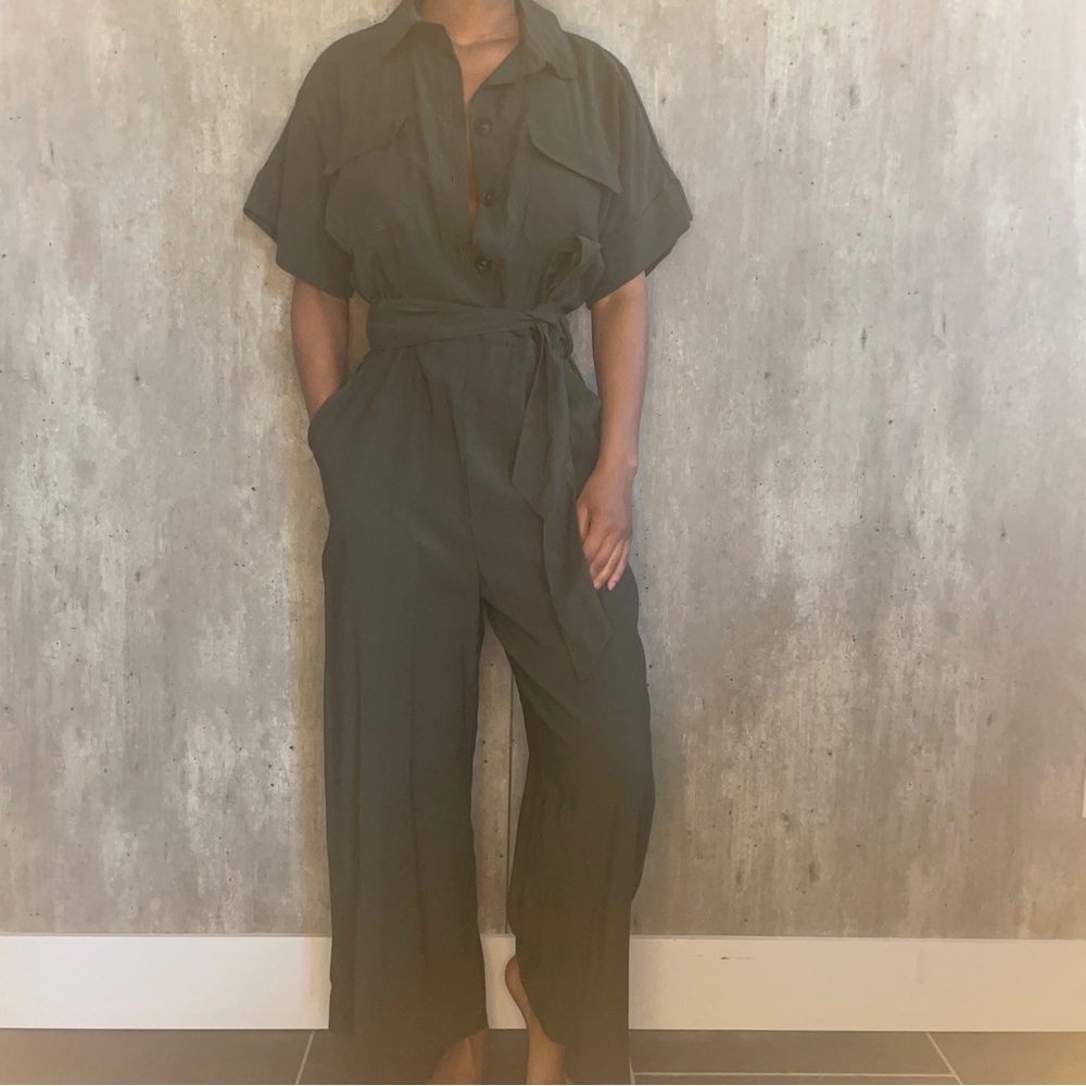 Army green cargo jumpsuit. Button up with belt. Pockets.